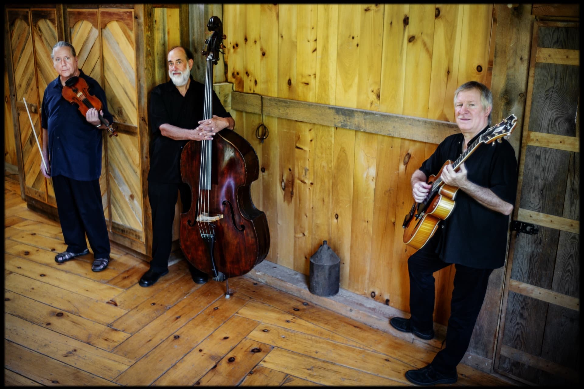 String Trio of New York in a barn interior — violin, bass, and guitar